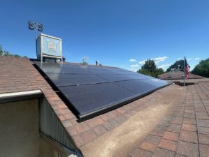 Newly installed solar panels on a residential rooftop, showcasing work by Pueblo Electrics, Inc. in Pueblo, CO.