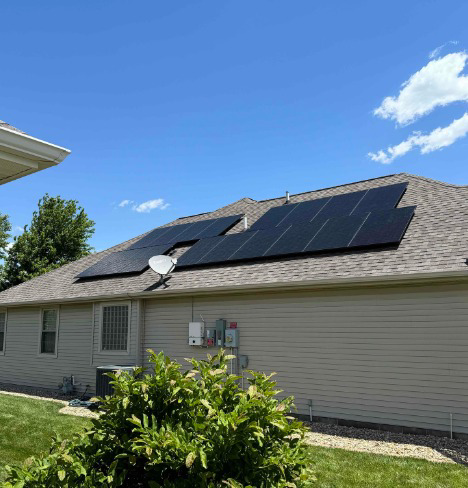 Residential solar panels installed on a rooftop by Edelman Heating, Cooling, Plumbing, Electric & Solar in Fairbury, IL.