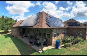 A residential home with a full solar panel installation on the roof by Premier Power in Edmond, OK.
