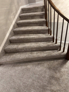 Professional carpet installation on a residential staircase by All about flooring utah in Salt Lake City, UT.