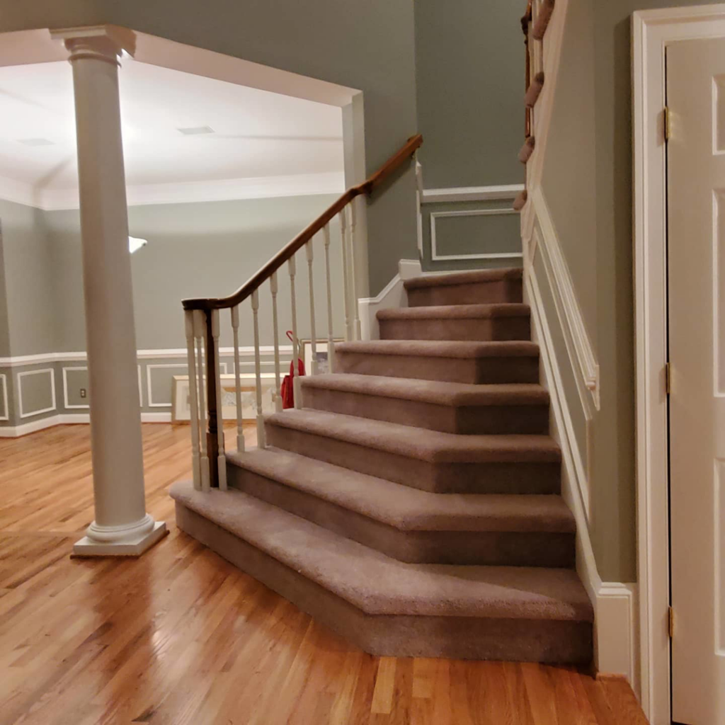 A residential staircase with newly installed brown carpet by Yankees Carpet Inc in Baltimore, MD