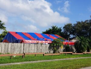 A residential property undergoing termite tenting by Monster Pest Control in Miami, FL.
