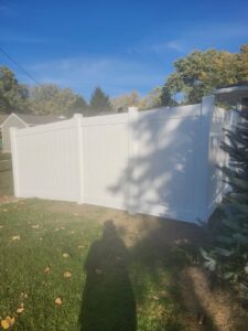 Residential white vinyl fence installation providing privacy in a backyard by Cameron Fence Builders in Indianapolis, IN.