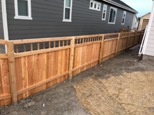 A completed residential wood fence installation project by ER Fencing LLC in Denver, CO.