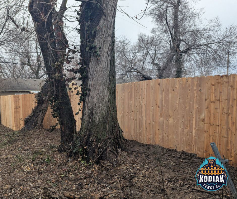 A long section of a new residential wood fence installed by Kodiak Fence Co. in Flower Mound, TX.