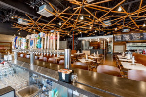 Interior of a restaurant and bar with various electrical lighting fixtures installed by Performance Electrical Contracting Inc. in Jacksonville, FL