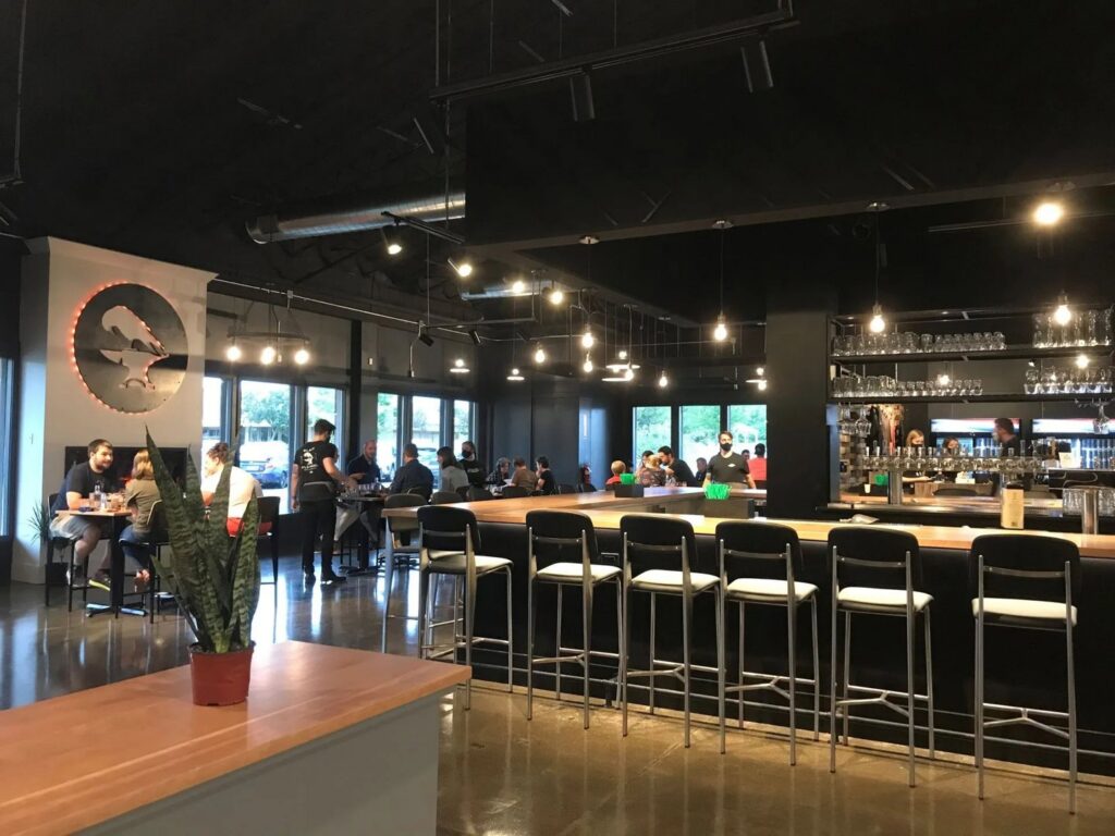 Interior view of a restaurant and bar with modern lighting fixtures installed by Cummings Electric in South Burlington, VT