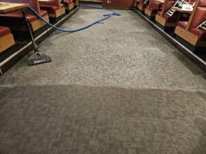 Before and after commercial carpet cleaning in a restaurant by Andy's Cleaning Company LLC in Topeka, KS.