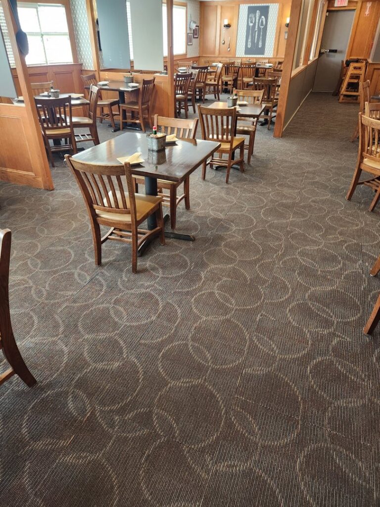 Patterned commercial carpet installed in a restaurant dining area by Carpet Center in Wilmington, NC.