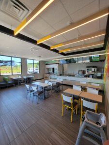 Modern linear lighting fixtures installed in a restaurant dining area by Sherrill Company, LLC Electrical Contractors in Columbus, GA.