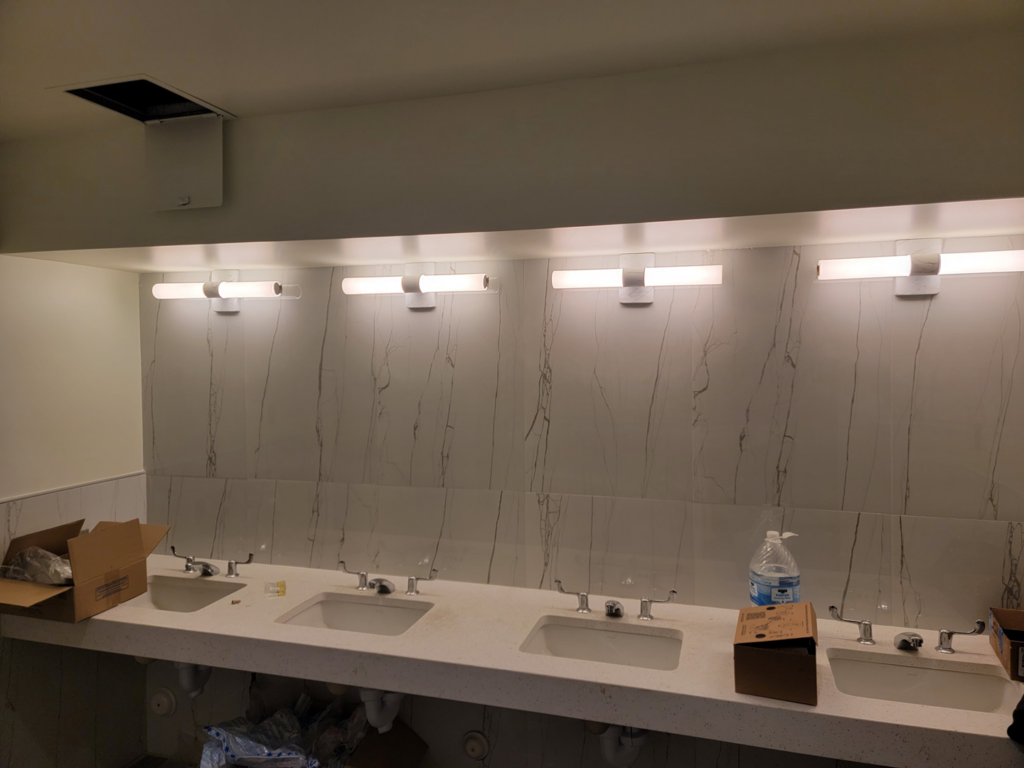 New vanity lighting fixtures installed in a commercial restroom by Trouble Shooters Electric Inc. in Pell City, AL