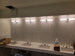 New vanity lighting fixtures installed in a commercial restroom by Trouble Shooters Electric Inc. in Pell City, AL