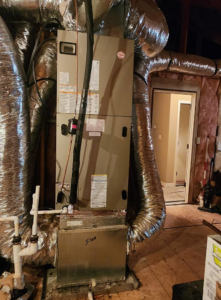 A Rheem air handler unit with insulated ductwork installed in an attic by Smith Heat an Air, LLC in Southaven, MS.