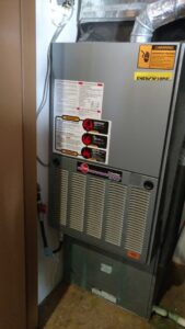 A Rheem Criterion furnace or air handler unit installed indoors by Raytech Refrigeration, Heating & Cooling in Alamogordo, NM.