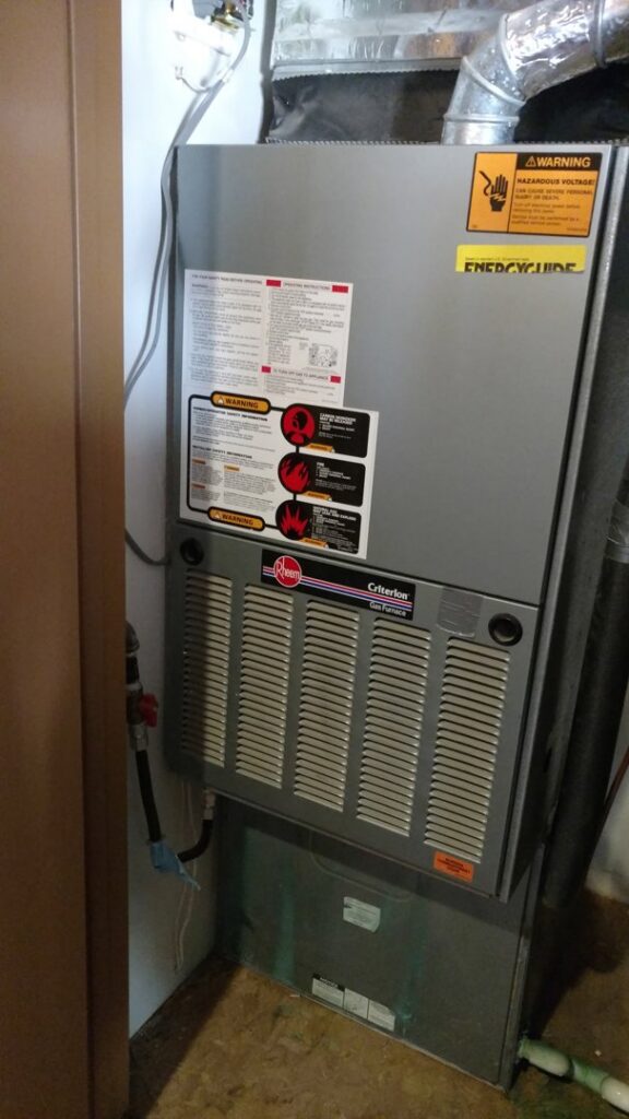 A Rheem Criterion furnace or air handler unit installed indoors by Raytech Refrigeration, Heating & Cooling in Alamogordo, NM.