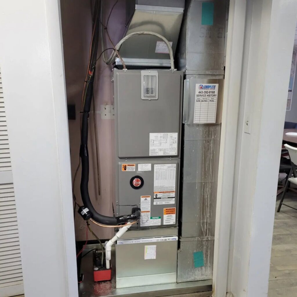 A Rheem furnace and air handler unit installed in a closet by Complete Mechanical Solutions in Novi, MI