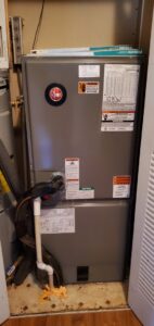 A Rheem furnace or air handler unit installed in a utility closet by MTZ Heating and Air Conditioning in Charlotte, NC.