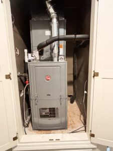 Rheem furnace installed in a utility closet by ACE Heating & Cooling, Inc. in Jonesboro, AR