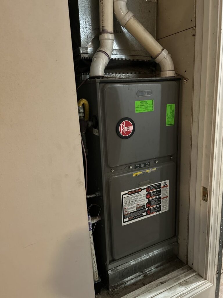 A Rheem furnace and air handler unit installed in a utility closet by Desert Sage Heating and Cooling in Albuquerque, NM.