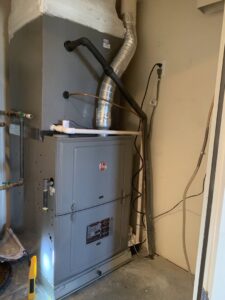 A Rheem furnace and air handler unit installed indoors by EA Heating & Cooling in El Paso, TX.