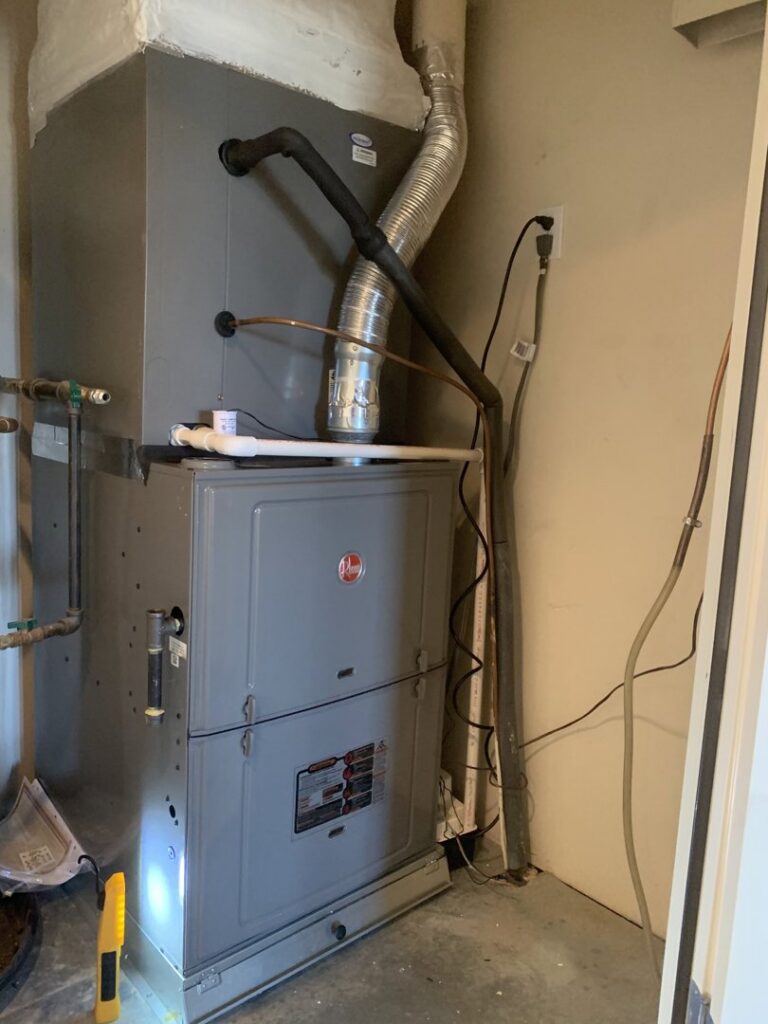 A Rheem furnace and air handler unit installed indoors by EA Heating & Cooling in El Paso, TX.