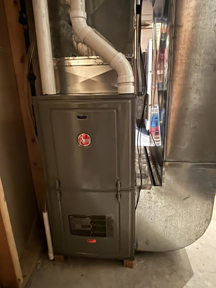 A Rheem indoor furnace unit with ductwork installed by Air Control Heating & Cooling LLC in Schererville, IN.