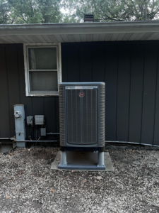 A Rheem outdoor AC condenser unit installed by Kai's Heat & Cool in Naperville, IL