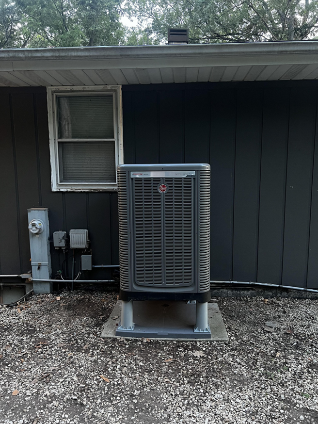 A Rheem outdoor AC condenser unit installed by Kai's Heat & Cool in Naperville, IL
