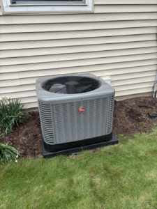 A Rheem outdoor air conditioning unit installed by Air Control Heating & Cooling LLC in Schererville, IN.