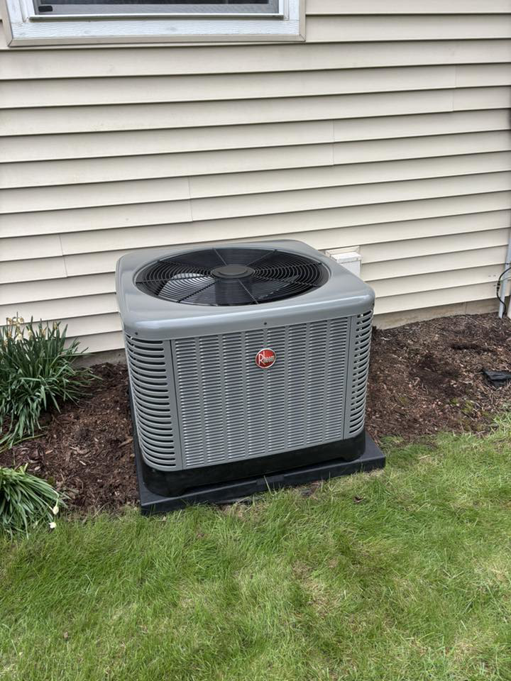 A Rheem outdoor air conditioning unit installed by Air Control Heating & Cooling LLC in Schererville, IN.