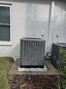 A Rheem outdoor AC unit installed outside a home by Air Support Cooling and Heating, LLC in Tampa, FL