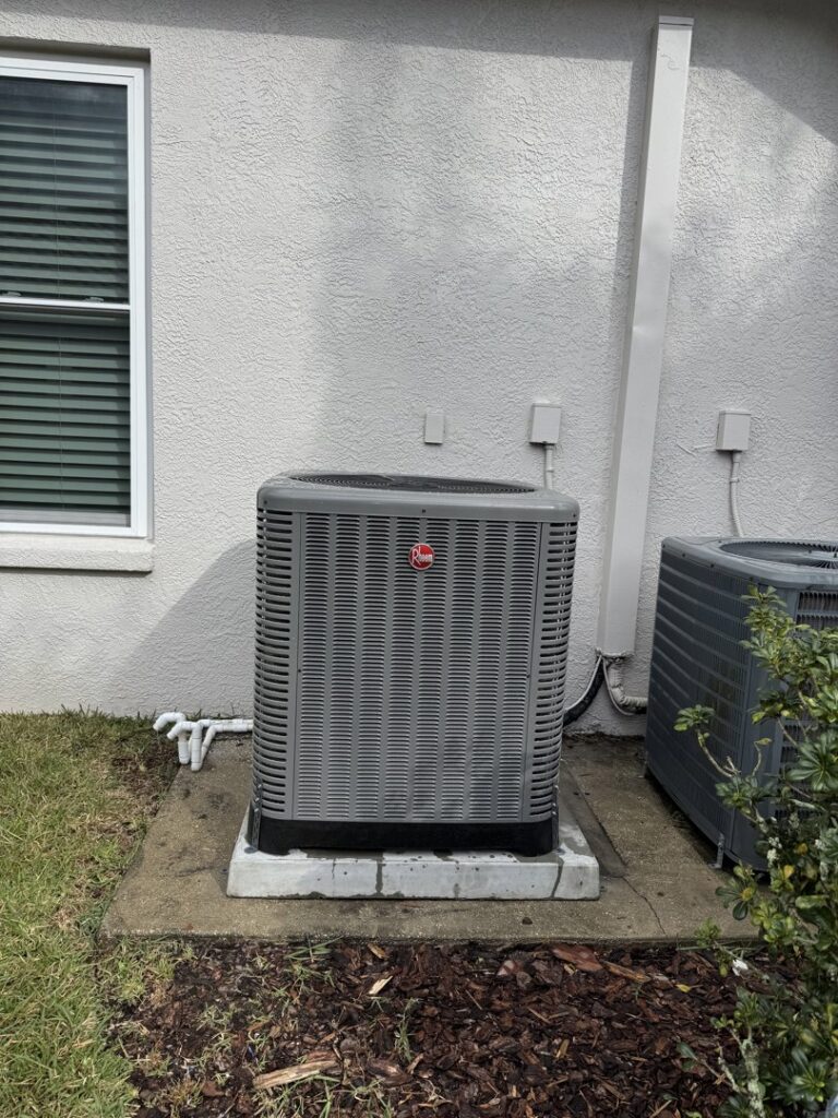 A Rheem outdoor AC unit installed outside a home by Air Support Cooling and Heating, LLC in Tampa, FL
