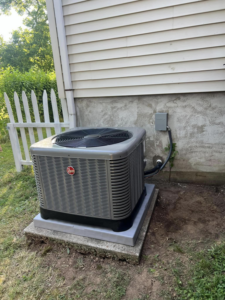 An outdoor Rheem air conditioning unit installed by VHL Services LLC in Elizabeth, NJ.