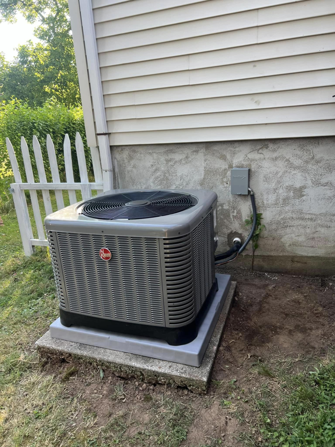 An outdoor Rheem air conditioning unit installed by VHL Services LLC in Elizabeth, NJ.