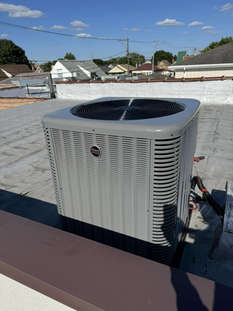 A Rheem rooftop AC unit receiving maintenance from Four Stages, a professional HVAC contractor in Chicago, IL.