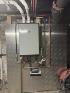 A Rheem tankless water heater installation with copper piping by C&A HVAC LLC in Springfield, PA.