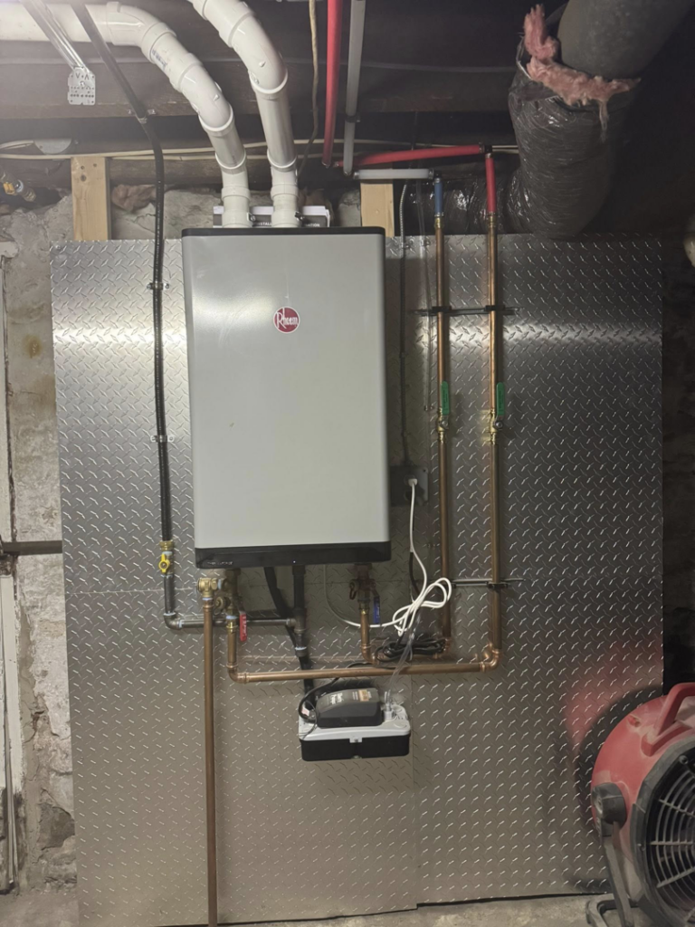A Rheem tankless water heater installation with copper piping by C&A HVAC LLC in Springfield, PA.