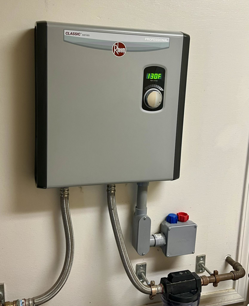 A newly installed Rheem tankless water heater by Pacifico Heating and Cooling in Shadyside, OH.