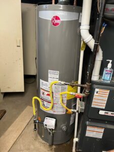 A Rheem water heater and furnace unit installed by Spartan Mechanical KC, serving Spring Hill, KS.