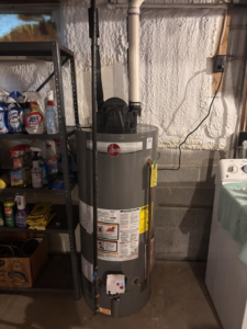 A Rheem water heater installed in a basement by Burley Hvac/r LLC in Syracuse, NY.
