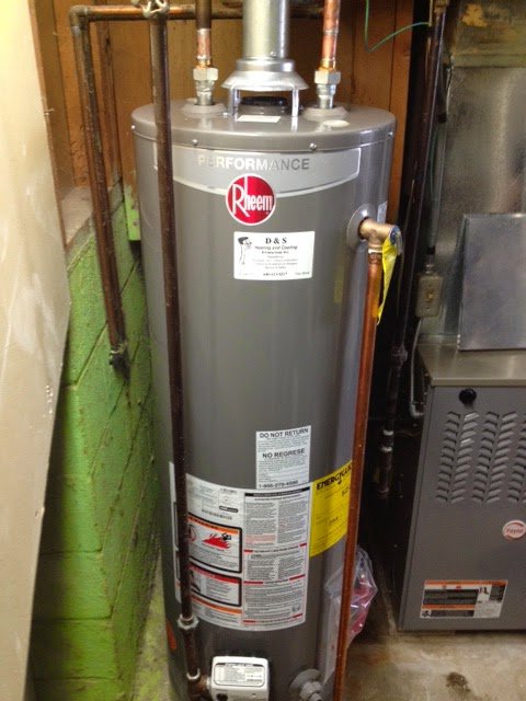 A newly installed Rheem water heater and furnace in a utility room by D &Sons Heating and Cooling LLC in Schenectady, NY