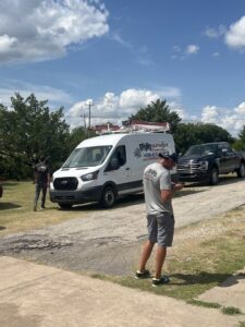 Rhino Heating and Air Conditioning LLC service vans and technicians on a job site, ready to provide HVAC services in Norman, OK.
