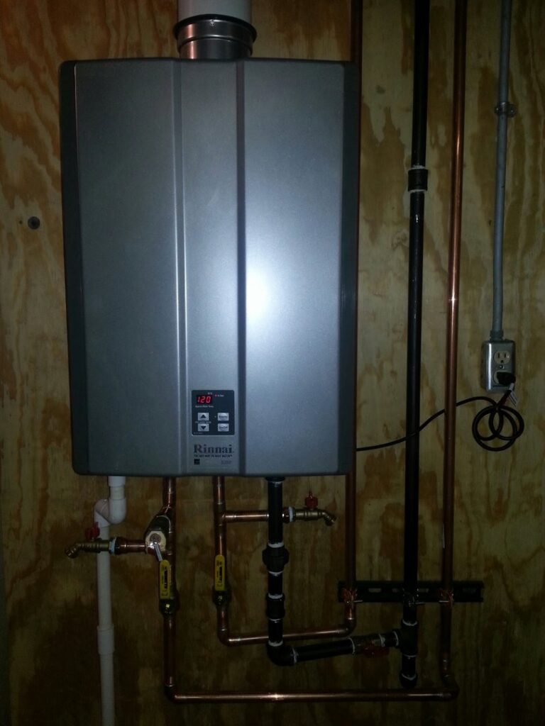 A Rinnai tankless water heater installation with copper piping by Custom Climates in Iowa City, IA.