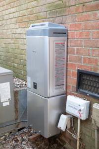 A newly installed Rinnai tankless water heater and HVAC unit by Travis Crawford Heating, Cooling, Plumbing & Electrical in Charlotte, NC.