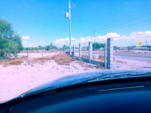 Roadside concrete block fence installation in progress by Arce Masonry LLC in Glendale, AZ