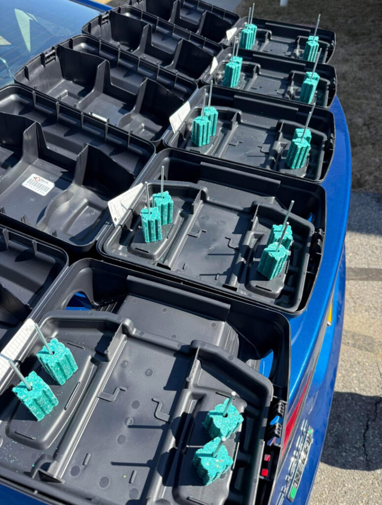 Multiple rodent bait stations with green bait blocks prepared for deployment by Devlins Pest Control in Reading, PA.