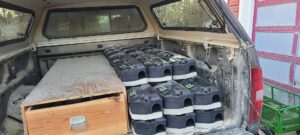 A truck bed filled with multiple rodent bait stations, ready for a pest control job by You Betcha Pest Control & Solutions LLC in Rochester, MN.