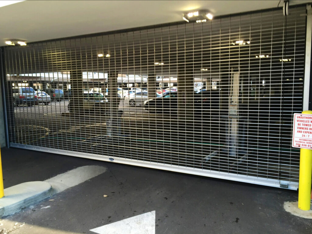 A roll-down security gate installed for a parking garage by Gates Access Solutions in San Diego, CA