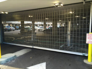 A roll-down security gate installed for a parking garage by Gates Access Solutions in San Diego, CA
