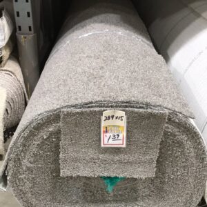 A large roll of grey textured carpet with a 'Low Price' tag, available at Gator Carpet and Tile in Jacksonville, FL.